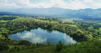 lake and green hills in Uganda